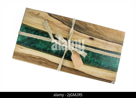 Oak wood and epoxy resin serving board with decorative rope and paper tag isolated on white background Stock Photo