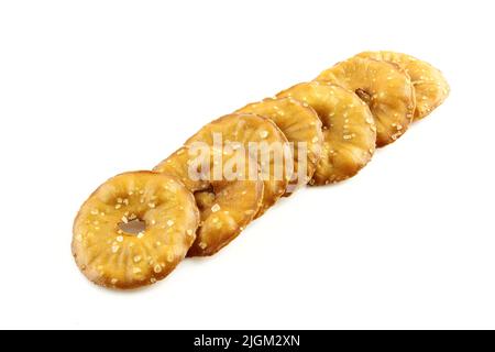 Cracker chips with sea salt isolated on white background. Round shape appetizers Stock Photo