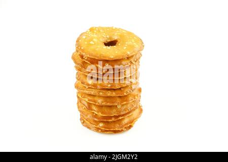 Stack of thin sea salt cracker chips isolated on white background Stock Photo