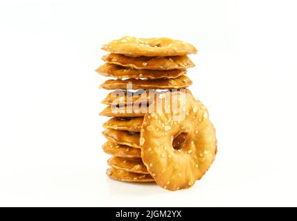 Stack of thin sea salt cracker chips isolated on white background Stock Photo