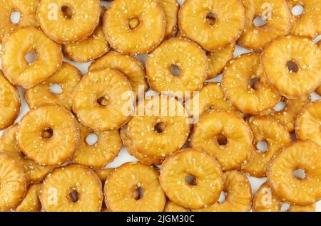 Background of thin sea salt cracker chips isolated on white background Stock Photo