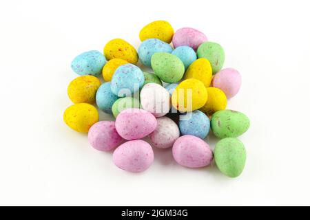 Colorful egg shaped chocolate candies isolated on white background Stock Photo