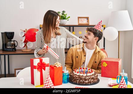 Mand and woman couple having birthday celebration at home Stock Photo