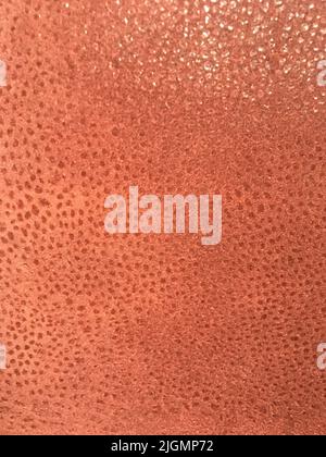 Rose gold metallic faux leather texture background Stock Photo