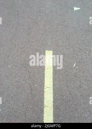 Gray asphalt road texture with dashed yellow line Stock Photo