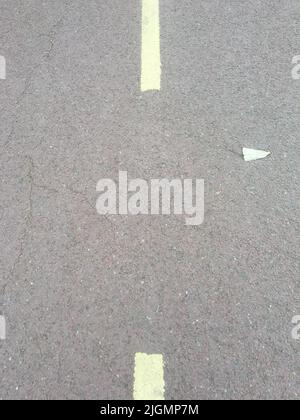 Gray asphalt road texture with dashed yellow line Stock Photo