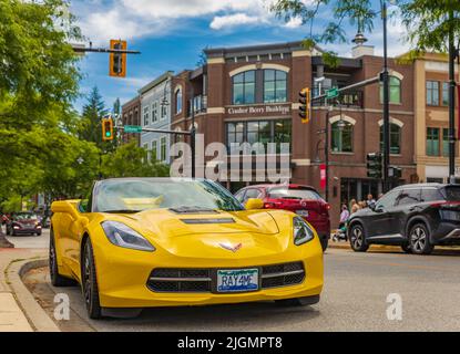 Yellow Chevrolet Corvette on a street. American muscle car Chevrolet Corvette at the urban city-July 5,2022-Langley BC Canada-Street photo, selective Stock Photo