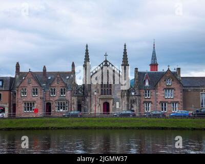 The 1837 St. Mary's Roman Catholic Church sits on the bank of the River Ness in Inverness, Scotland, UK. Stock Photo