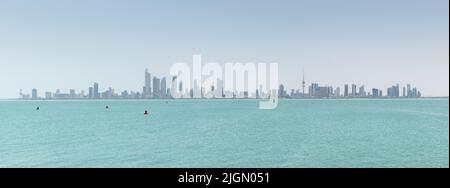 Kuwait City, Kuwait - July 7 2022: A panoramic view of Kuwait City with the Arabian Gulf in the foreground Stock Photo