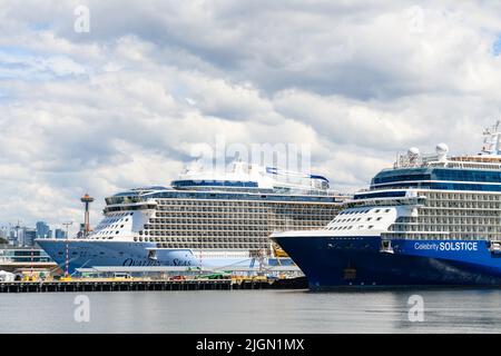 Seattle - July 08, 2022; Cruise Ship Celebrity Solstice and Ovation of the Seas docked in Seattle during the summer Alaska cruising season Stock Photo