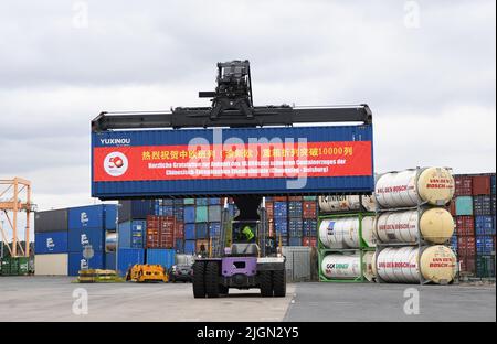 Duisburg. 11th July, 2022. Photo taken on July 11, 2022 shows a scene from the welcome ceremony for the 10,000th trip made by China-Europe freight trains operated by the China-Europe Railway Express (Chongqing) in Duisburg, Germany. A freight train loaded with electronic products, mechanical parts and daily necessities, which departed from southwest China's Chongqing Municipality on June 23, arrived in Duisburg, Germany on Monday. Credit: Ren Pengfei/Xinhua/Alamy Live News Stock Photo