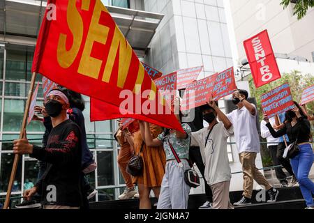 Manila, Philippines. 12th July, 2022. Activists carry signs as they march during a protest to mark the sixth anniversary of an international tribunal ruling in front of the Chinese Consulate in Makati city, Philippines. July 12, 2022. The protesters called on the government of China to respect the Philippines' rights over its exclusive economic zone or EEZ in the disputed South China Sea mandated by the UN Convention of the Law of the Sea or UNCLOS. (Credit Image: © Basilio Sepe/ZUMA Press Wire) Stock Photo