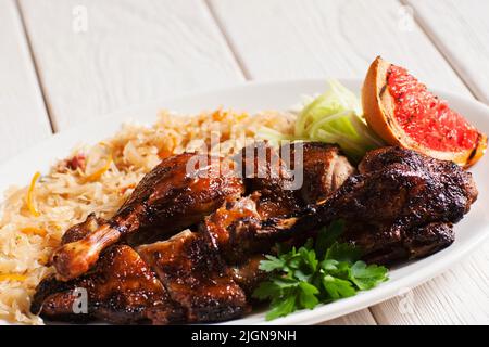 Grilled duck served with stewed cabbage Stock Photo