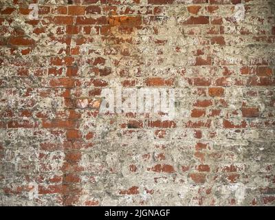 Dirty old brown red brick wall texture, Weathered plastered old red brick grunge wall pattern for background with copy space Stock Photo