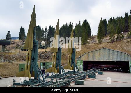 Coe pass, Trentino, Italy. Cold war. Ex NATO base Tuono ( Thunder) .Missiles Nike-Hercules on launch pads and the hangar. Stock Photo