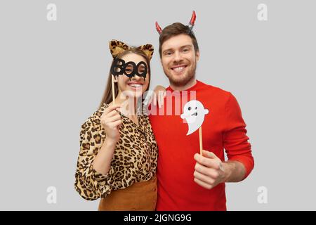 couple in halloween costumes of devil and leopard Stock Photo