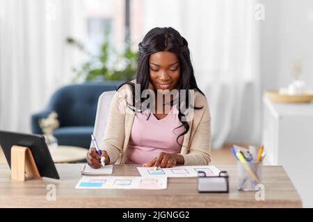 african woman working on ui design at home office Stock Photo