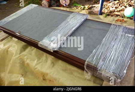 Close up on stack of  window mosquito net screens before installation. Stock Photo