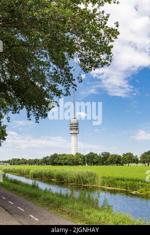 Landscape with Beilervaart and transmission tower Smilde in the backgroundThe Netherlands Stock Photo