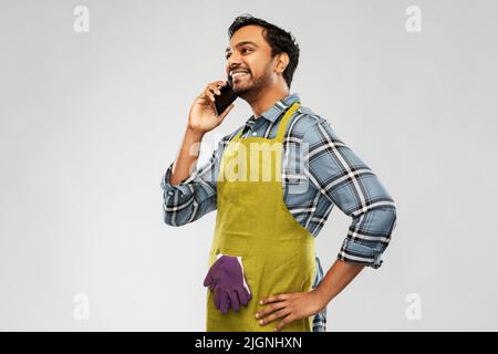 indian gardener or farmer calling on smartphone Stock Photo