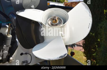 Boat Engine propeller. Close up on three  bladed propeller as boat transportation concept. Stock Photo