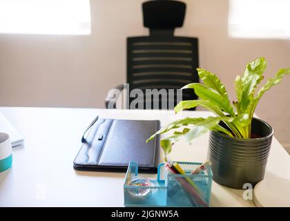 An empty desk in an executive's office with neat organised workspace Stock Photo