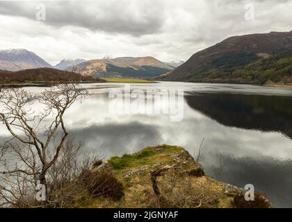 View from Bishop's Bay, Loch Leven, with mountains in the background Stock Photo