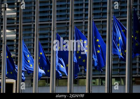 Brussels, Belgium. 12th July, 2022. European flags are flown at half-mast for the funeral of Shinzo ABE, former Japanese Prime Minister in front of Headquarters of European Union in Brussels, Belgium on July 12, 2022. Credit: ALEXANDROS MICHAILIDIS/Alamy Live News Stock Photo