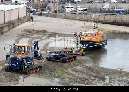 Recovery of Shannon Class Lifeboat RNLB 13-36 John and Elizabeth Allan at Seahouses Harbour, North Sunderland, England Stock Photo