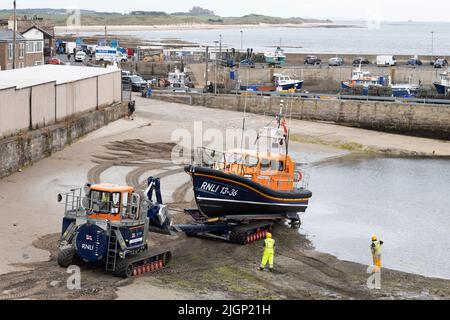 Recovery of Shannon Class Lifeboat RNLB 13-36 John and Elizabeth Allan at Seahouses Harbour, North Sunderland, England Stock Photo