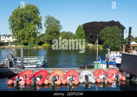 row of self-drive boats for hire, from the company riverscapes, moored on the river thames at kingston upon thames, surrey, england Stock Photo