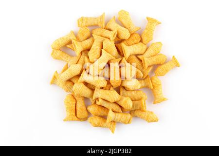 Pile of fish shaped crispy corn puffs isolated on white background Stock Photo