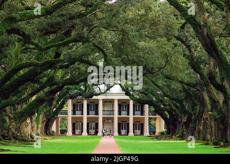 Visitors stroll the grounds of Vacherie Plantation, known as Oak Alley Plantation, one of the most visited plantation homes in the New Orleans area Stock Photo