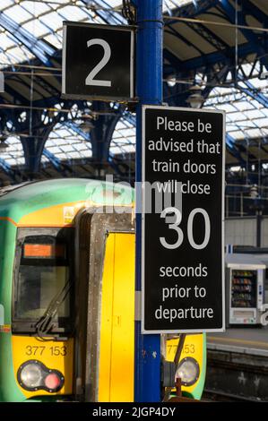 Platform sign at a Brighton Railway Station, England. Stock Photo