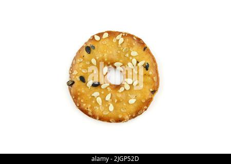 Single round cracker with sesame seeds isolated on white background Stock Photo