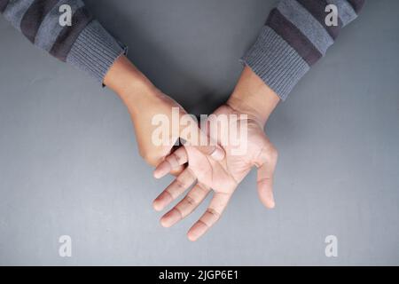 man suffering pain in hand top view  Stock Photo