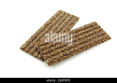 Sticky and crunchy bars with chocolate and sesame isolated on white background Stock Photo