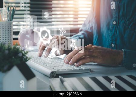 Quality management with QA (assurance), QC (control) and improvement, Businessman hand working with VR screen quality management icon on laptop comput Stock Photo
