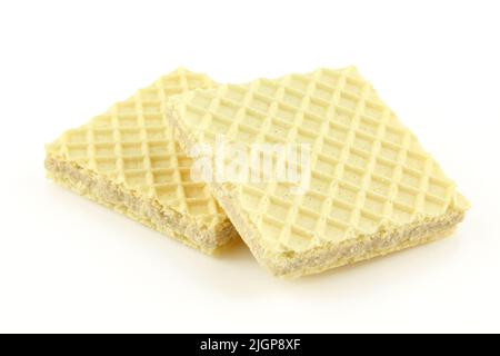 Two thin vanilla cream filled wafers isolated on white background Stock Photo