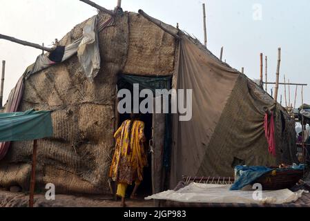 Pakistani gypsy spread salted meat for drying on a charpai collected from different places during the 2nd day of the Muslims Eid al-Adha celebration or Festival of Sacrifice in Lahore. Muslims celebrate Eid al-Adha or Feast of Sacrifice, the second of two Islamic holidays celebrated worldwide marking the end of the annual pilgrimage or Hajj to the Saudi holy city of Mecca and commemorating the willingness of the Prophet Ibrahim, Abraham to Christians and Jews, to sacrifice his son. During the holiday, which in most places lasts four days, Muslims Slaughtering sheep, goats, cows, and camels to Stock Photo