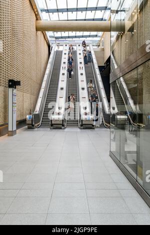 Entrance hall of Paddington station on the new Elizabeth Line underground in London. With a dramatic wall of punched brickwork. Stock Photo