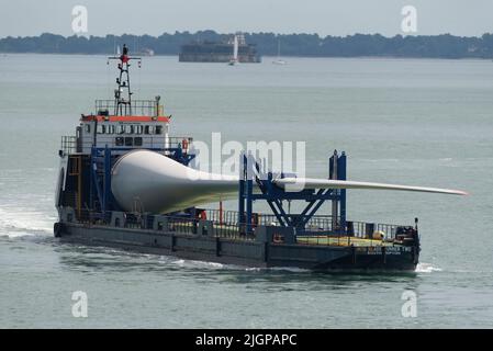 Portsmouth southern England UK. 2022. Wind turbine blade as cargo on Blade runner two  ship underway crossing The Solent bound for Portsmouth Harbour. Stock Photo