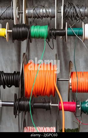 Spools of multi-colored electrical wires in a hardware store. Stock Photo