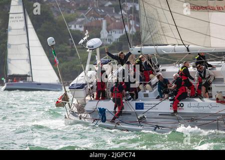 The busy crew of Challenge 72 yacht Catzero from Humberside as they compete in the Isle of Wight Round The Island Yacht Race on the South Coast. Stock Photo