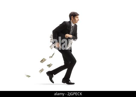 Full length profile shot of a businessman running and holding a briefcase full of money isolated on white background Stock Photo