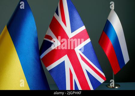 The flags of Ukraine and Great Britain are far from the flag of Russia. Stock Photo