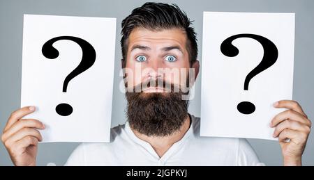 Beard man question mark, solution problems. Thinking man with question mark Stock Photo