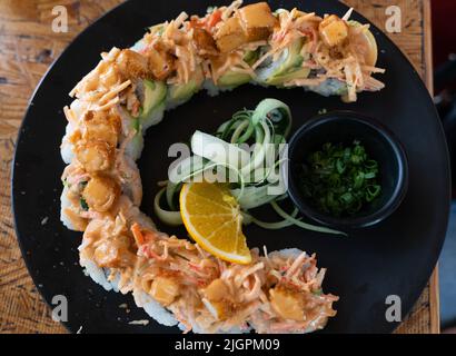 Sushi roll plate with breaded prawn and sauce view from top. Traditional Japanese food by Mexican style concept Stock Photo