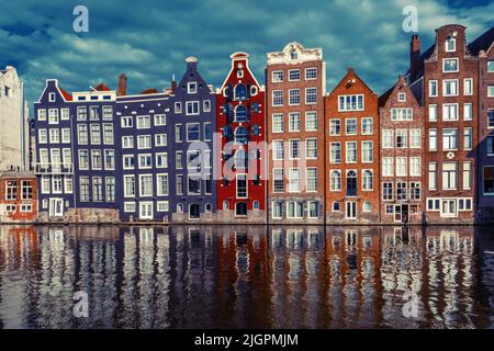 Old Historical Houses At The Canal Around Damrak Amsterdam Stock Photo