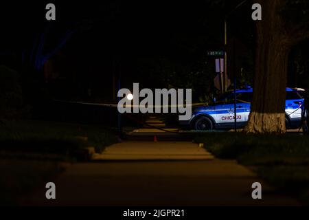 Chicago, USA. 17th June, 2022. Shell casings are marked near a parked police SUV at a crime scene where a man was shot to death on a porch in Chicago, IL on June 17, 2022. (Photo by Daniel Brown/Sipa USA) Credit: Sipa USA/Alamy Live News Stock Photo